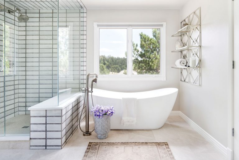 The large window-pane-like shower tile in the master bathroom is an unexpected focal point.