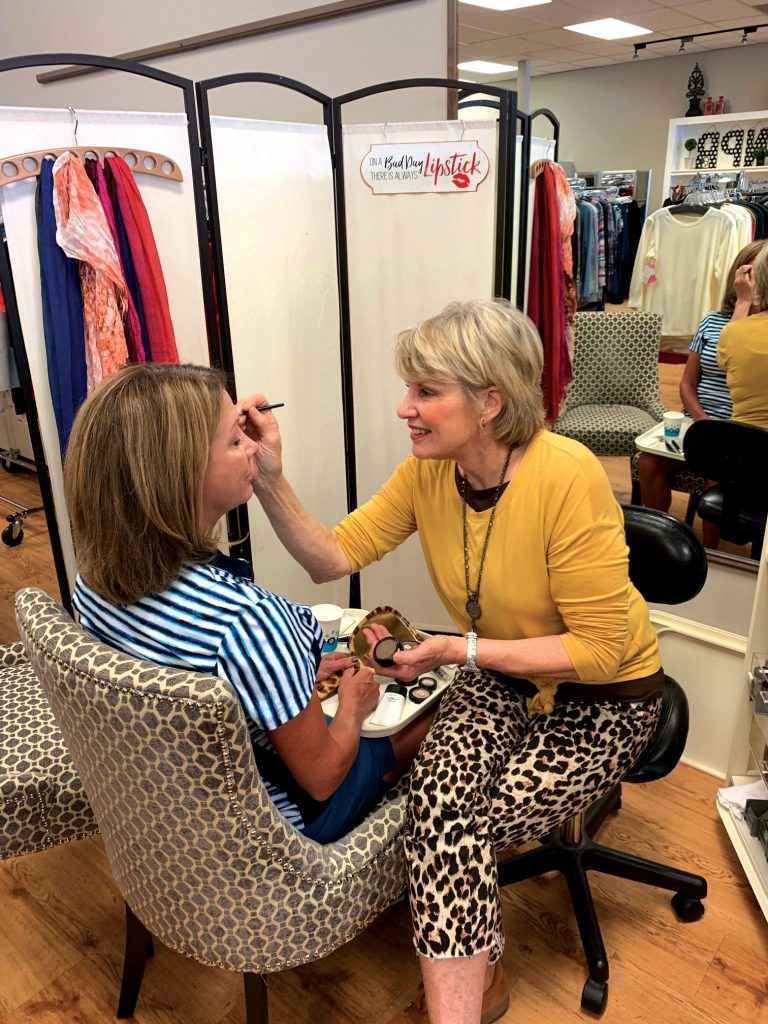 Never Pay Retail's owner Ann Fulton doing a color consultation.