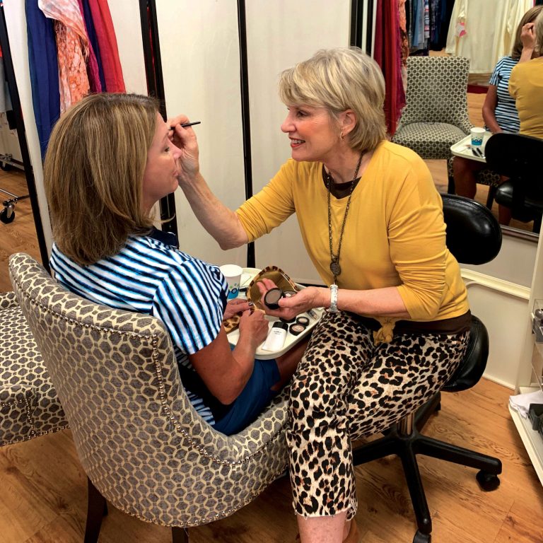 Never Pay Retail's owner Ann Fulton doing a color consultation.